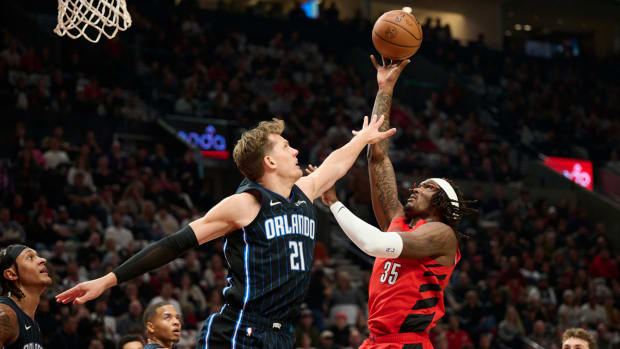 Oct 27, 2023; Portland, Oregon, USA; Portland Trail Blazers center Robert Williams III (35) shoots a basket during the first half against Orlando Magic center Moritz Wagner (21) at Moda Center.
